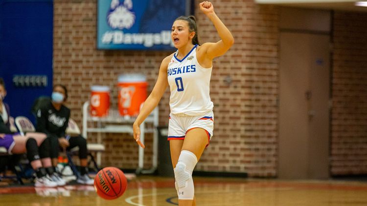 Maguire sisters score 10 apiece as Huskies win at home