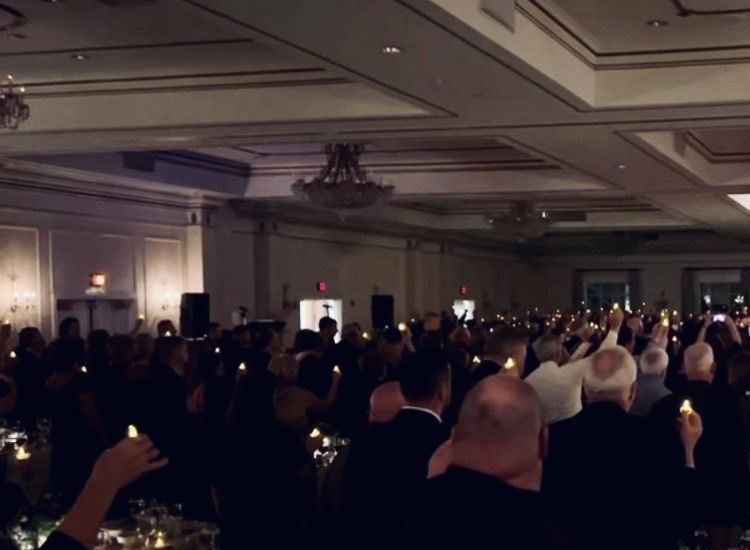 Solemn Moment at Emerald Celebration