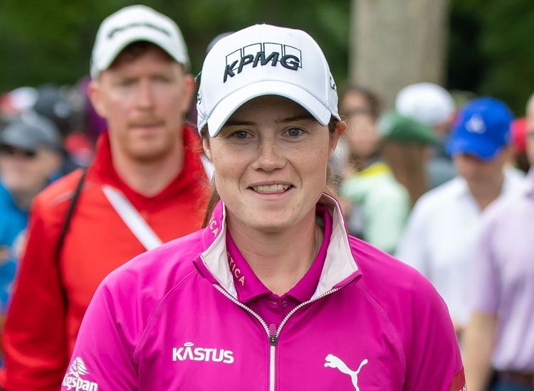 Maguire closes gap with Sunday 66