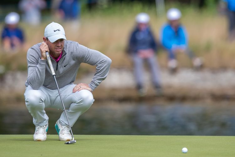 McIlroy perseveres, wins FedEx Cup, Tour Championship