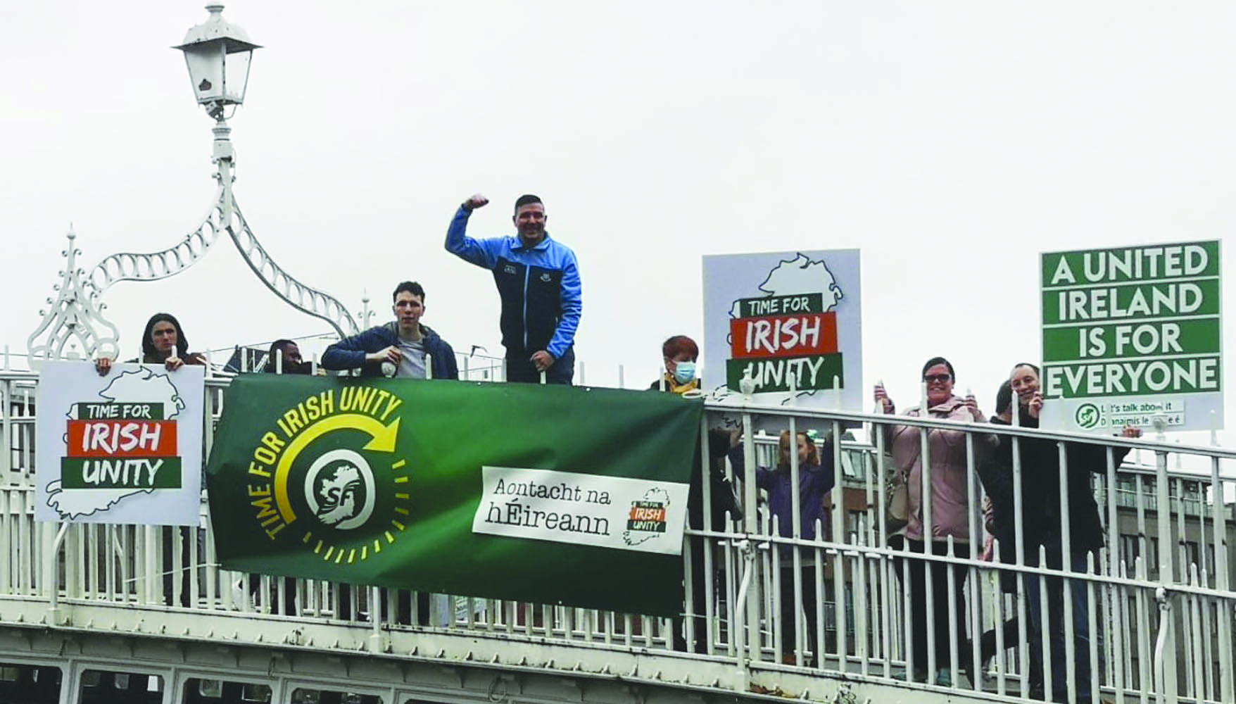 Shouting it from the bridge top. Supporters of Irish unity on the Ha’penny Bridge in Dublin.