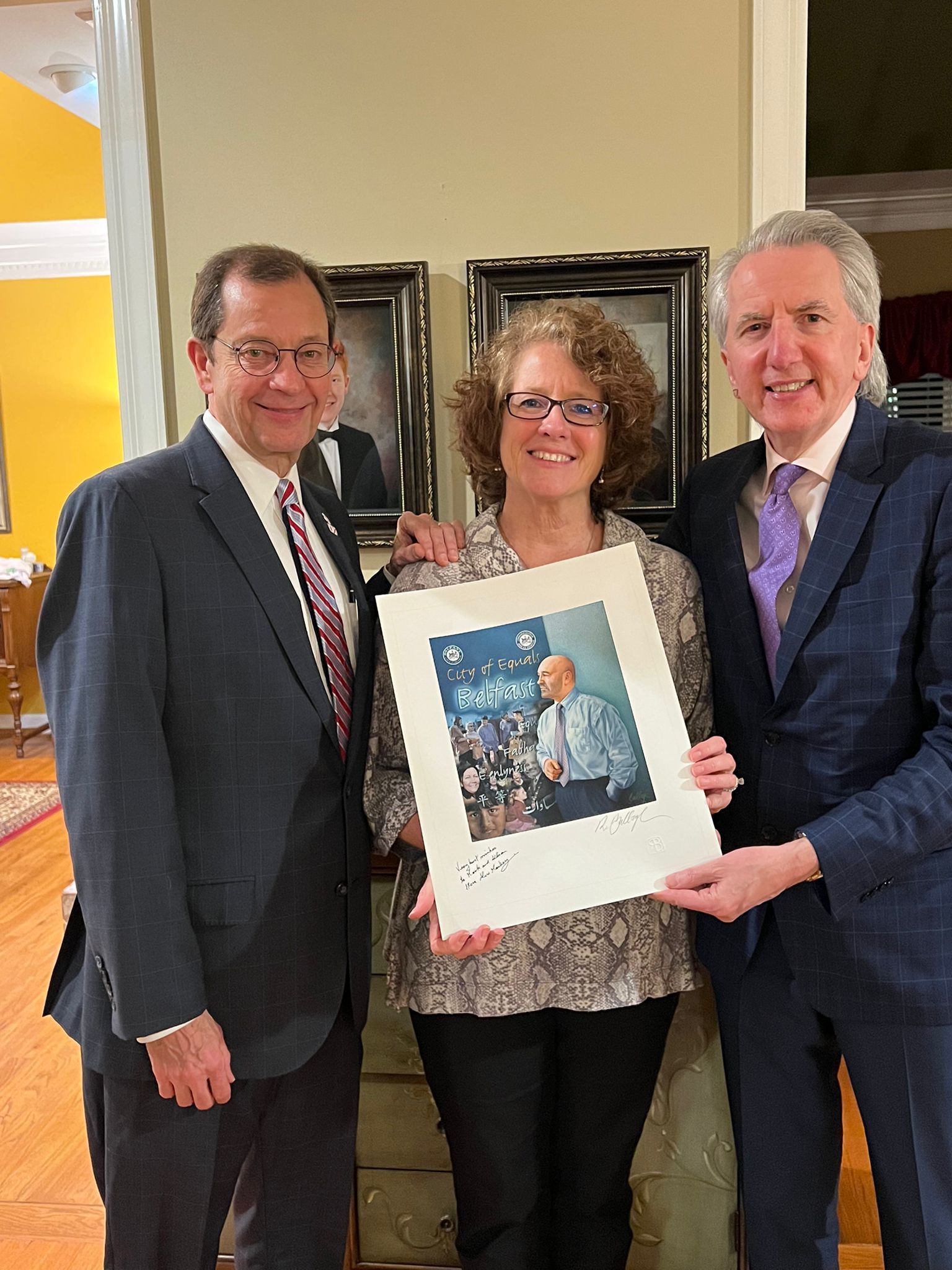 PARALLELS: Presenting a print of a portrait by Robert Ballagh of Alex Maskey, the first republican mayor of Belfast, to Allison and Mark Jackson at the Birmingham home. 