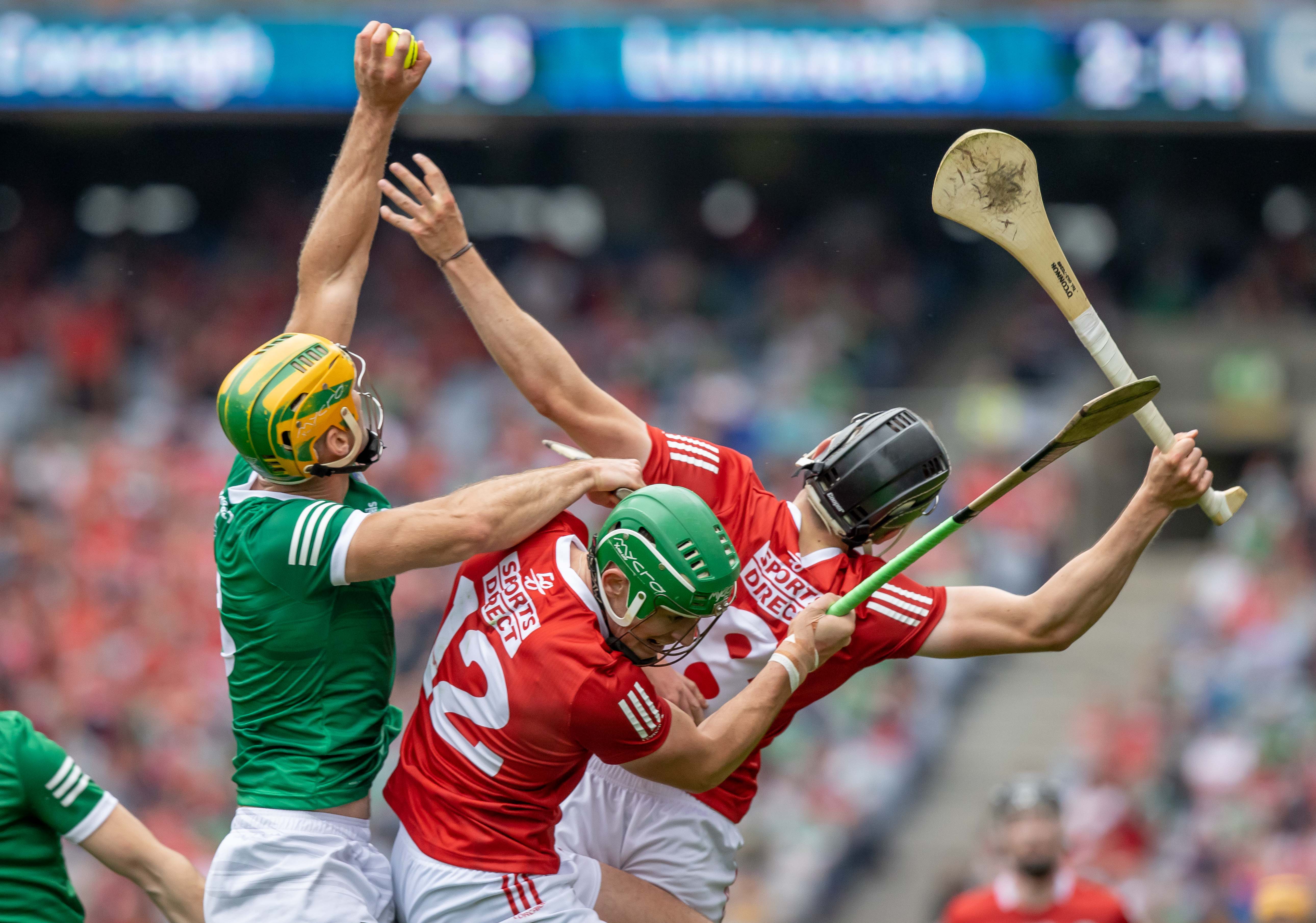 Limerick’s Dan Morrissey grabs the ball ahead of Cork’s Robbie O’Flynn and Darragh Fitzgibbon during the All Ireland hurling final on Aug. 22. INPHO/MORGAN TREACY
