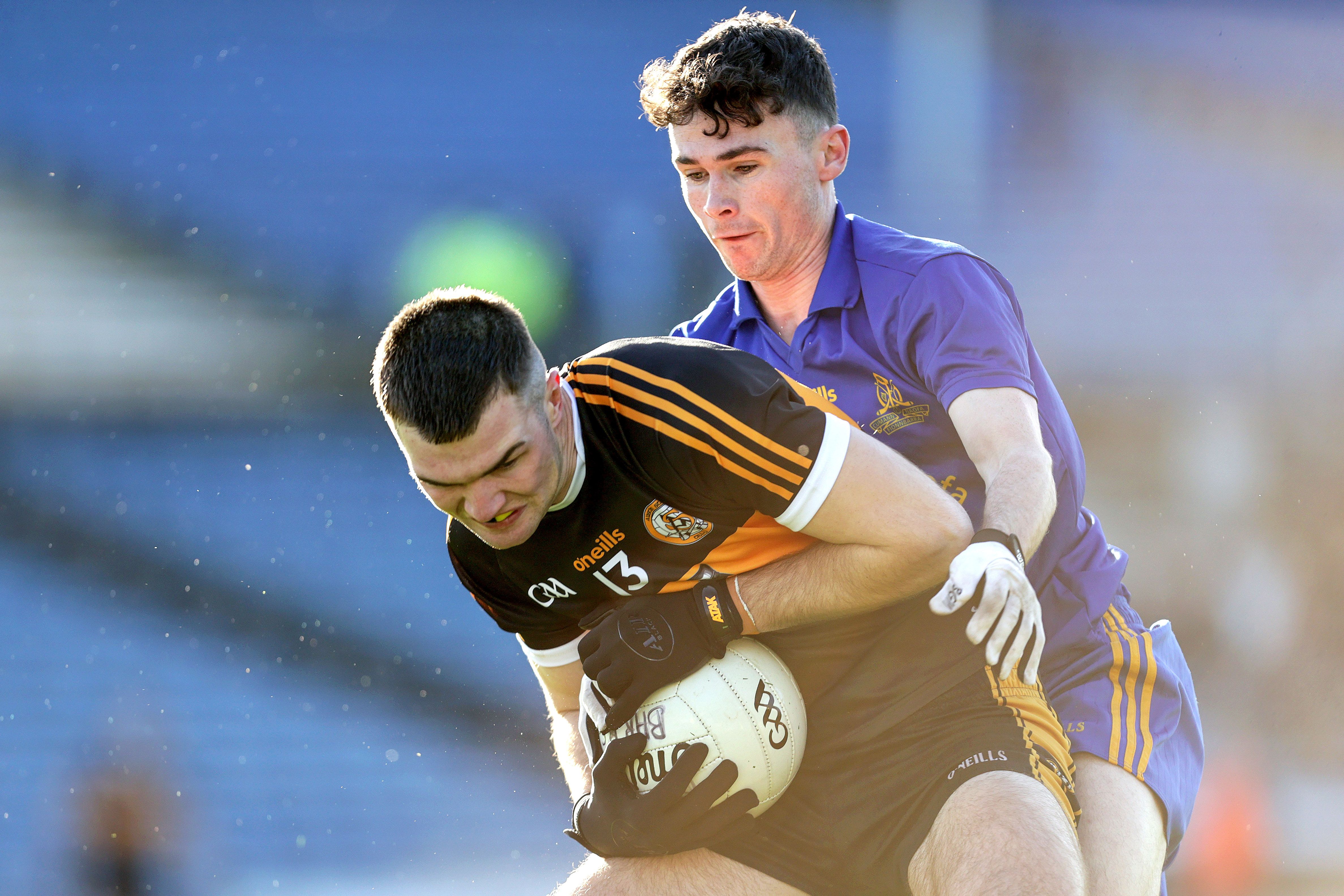 Austin Stacks’ Sean Quilter is tackled by Colm Scully of St. Finbarr’s.  INPHO/LASZLO GECZO