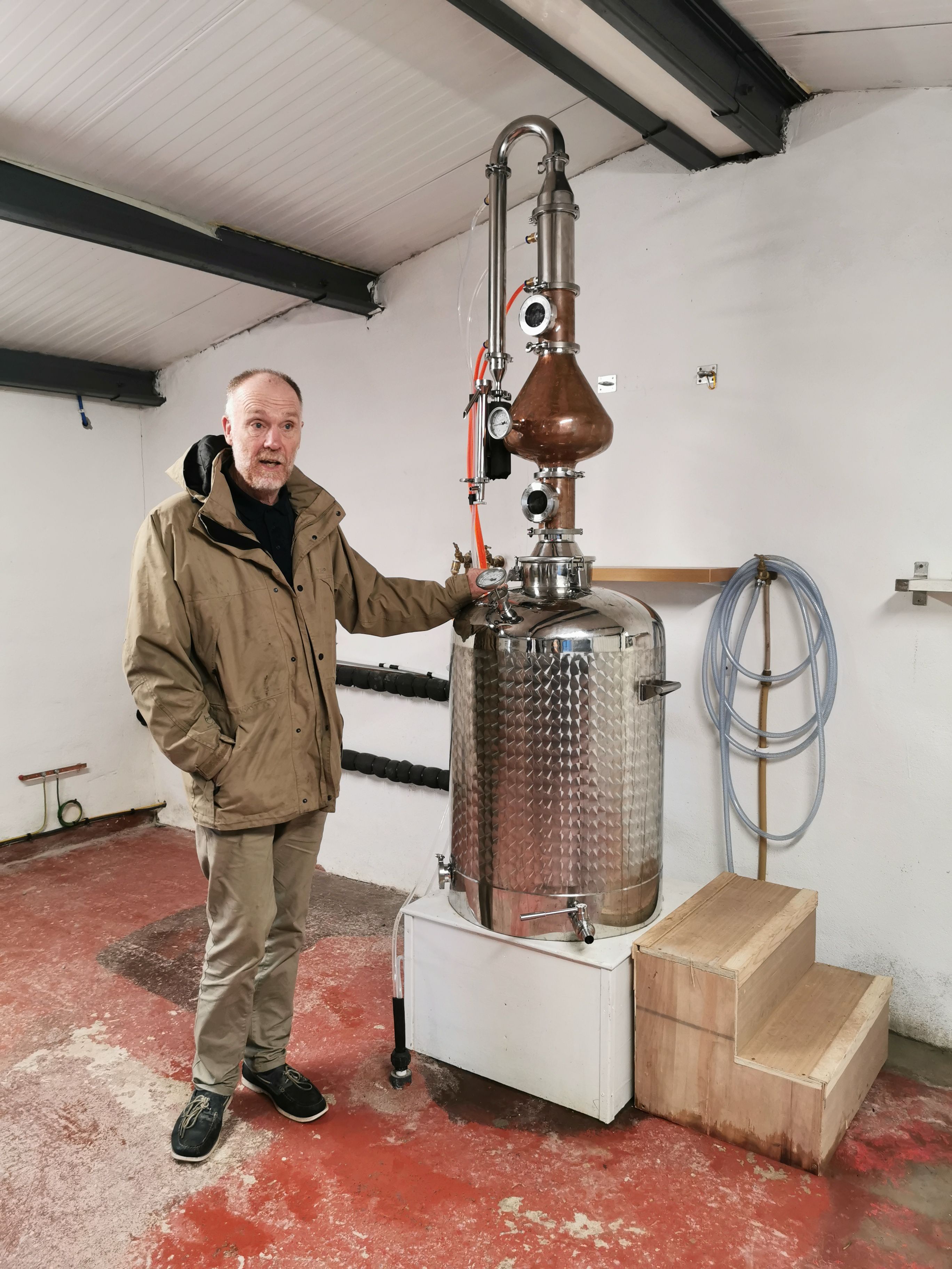 Seamus Ó Drisceoil standing still beside one.