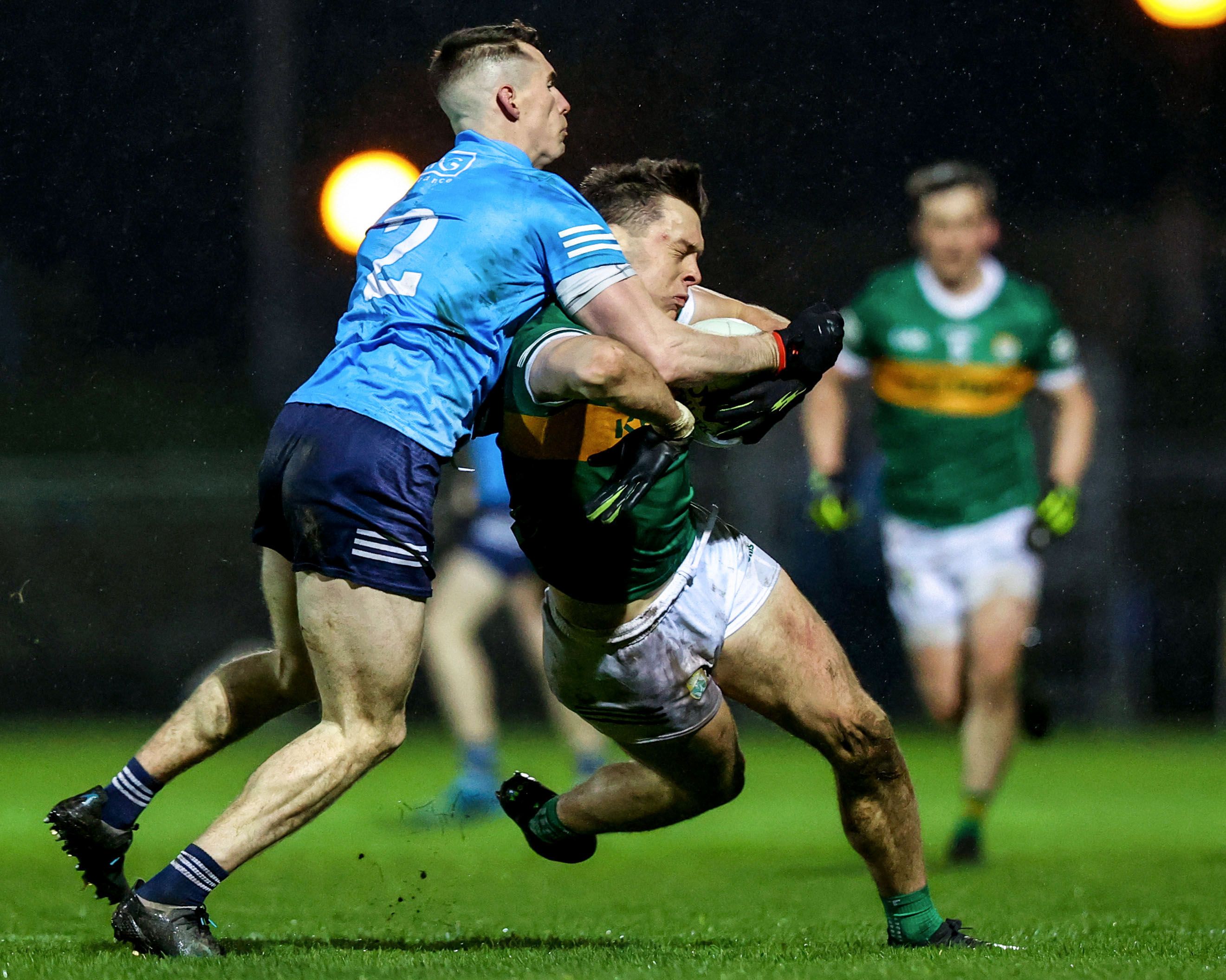 Dublin's Lee Gannon attempts a tackle on David Clifford of Kerry, for which he gets a yellow card. INPHO/BEN BRADY