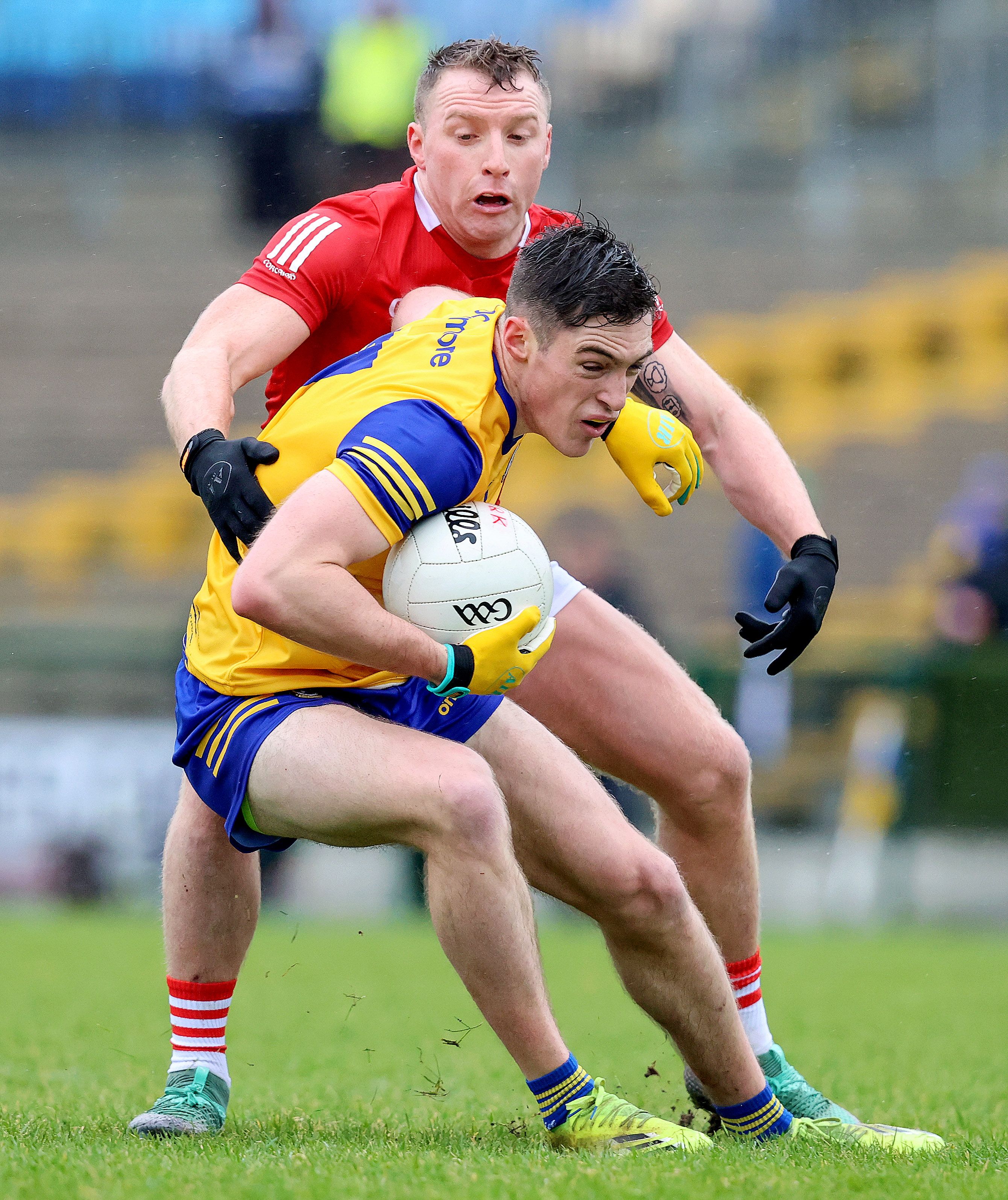 Roscommon’s Richard Hurley is challenged by Brian Hurley of Cork at Dr. Hyde Park. Roscommon won the Div. 2 game 1-13 to 0-10. INPHO/BRYAN KEANE