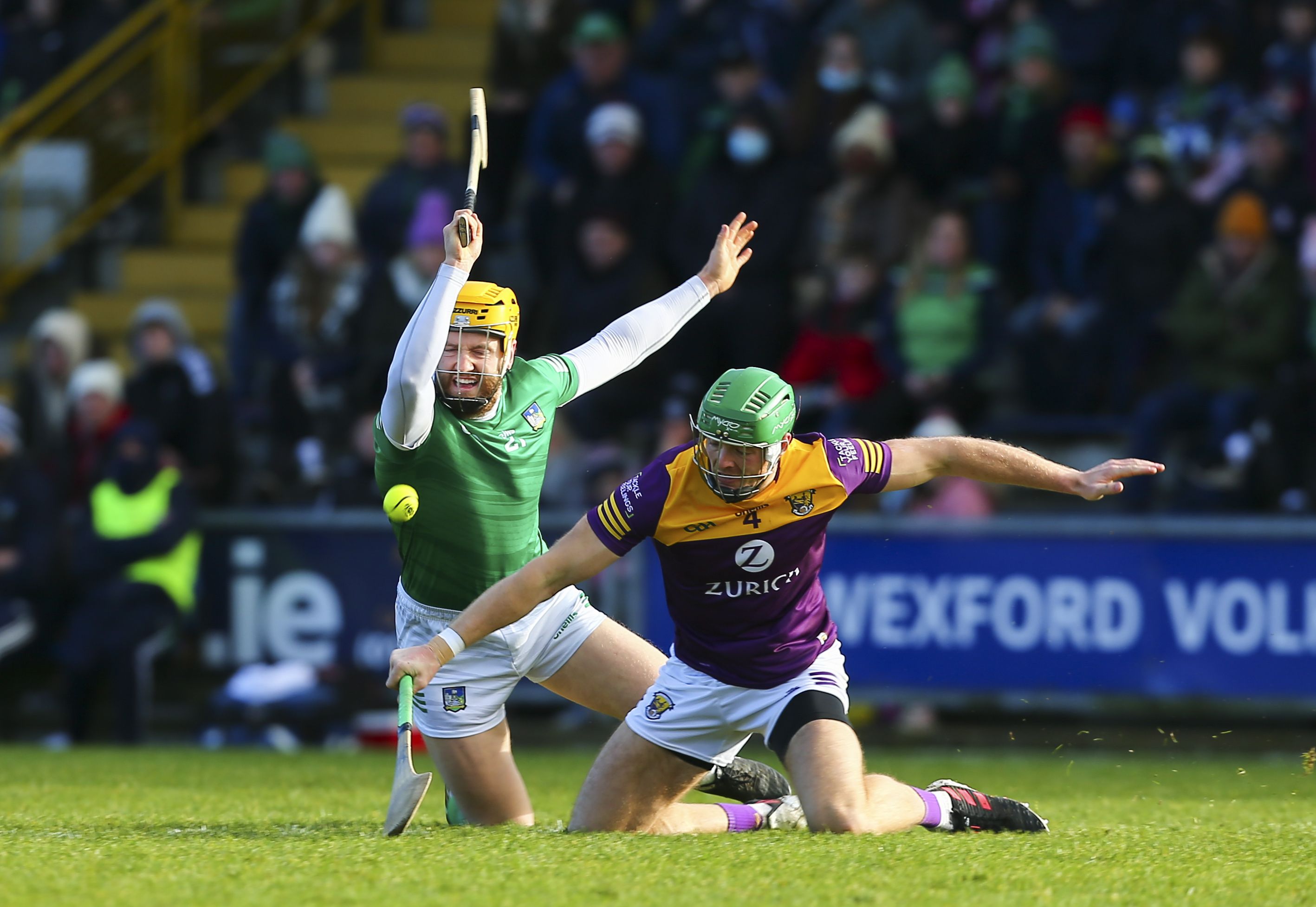 Wexford's Matthew O'Hanlon, right, and Limerick's Seamus Flanagan compete for the ball. INPHO/KEN SUTTON