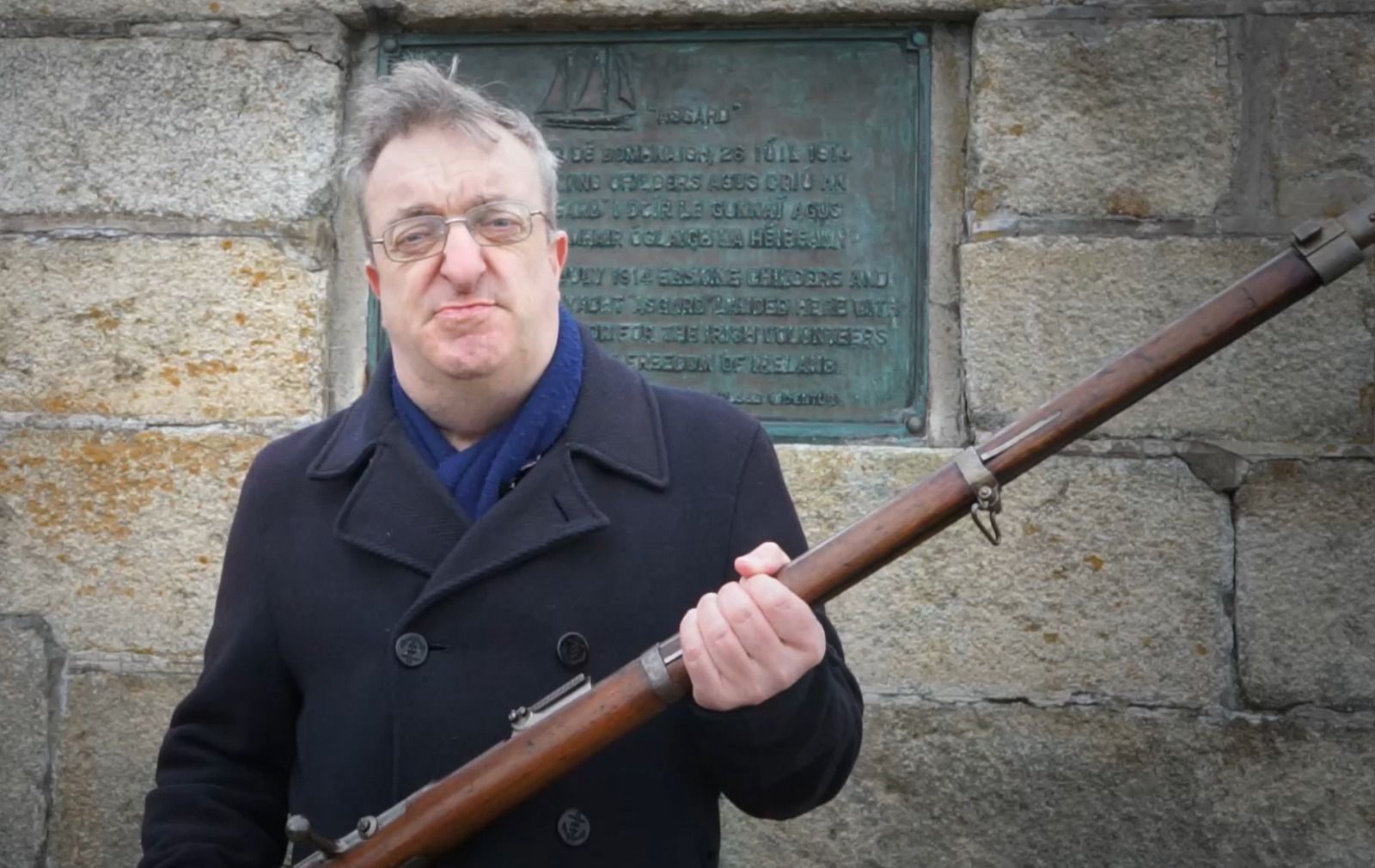 Micheál MacDonncha of the Moore Street Preservation Trust with the Mauser Rifle that is to be raffled.