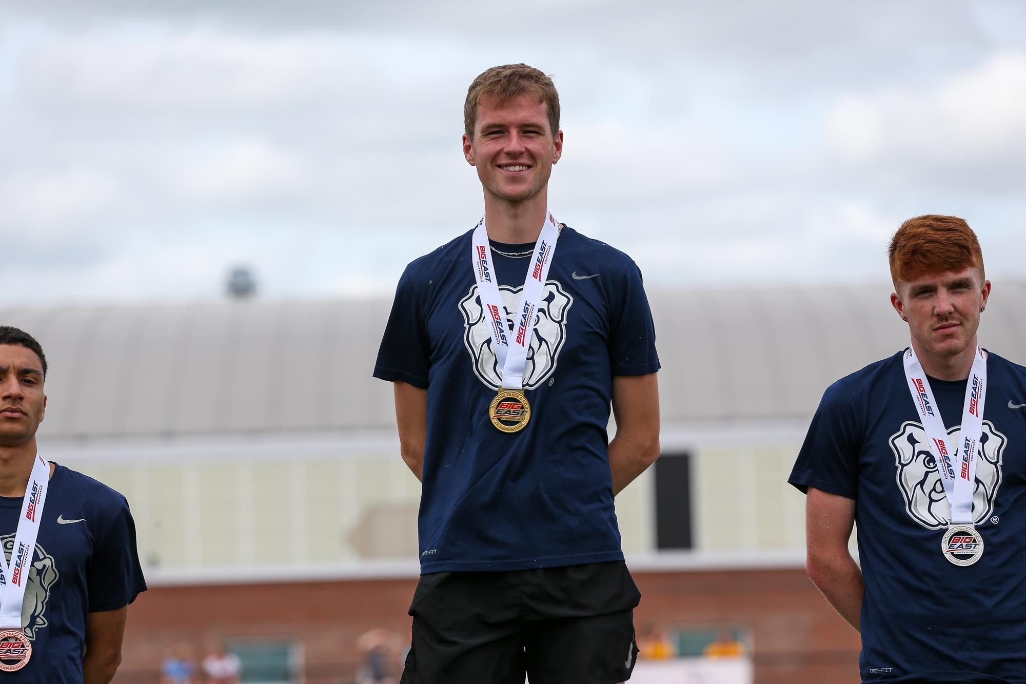 Barry Keane (center) and Evan Byrne (right) of Butler University on the medals platform after the men's 10,000 meters at the Big East Outdoor Track & Field Championship meet in Storrs, Conn. CLARUS MULTIMEDIA