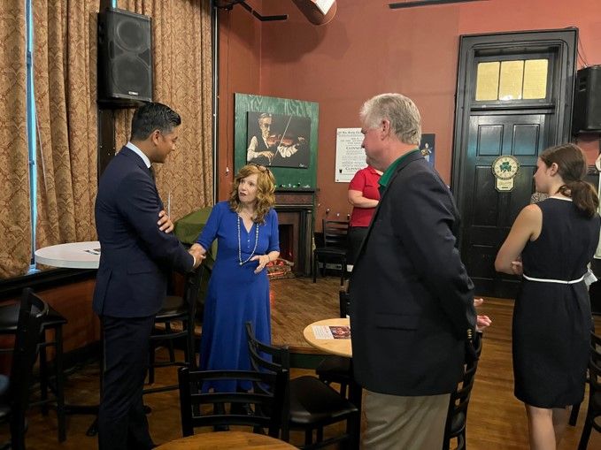 FÁILTE: Maureen Kennedy and Brian Malloy, President of the Friendly Sons of St Patrick, welcome Mayor Pureval. Pic Judy Sweeny.