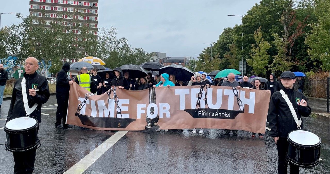 The marchers followed a "Time for Truth" Banner.