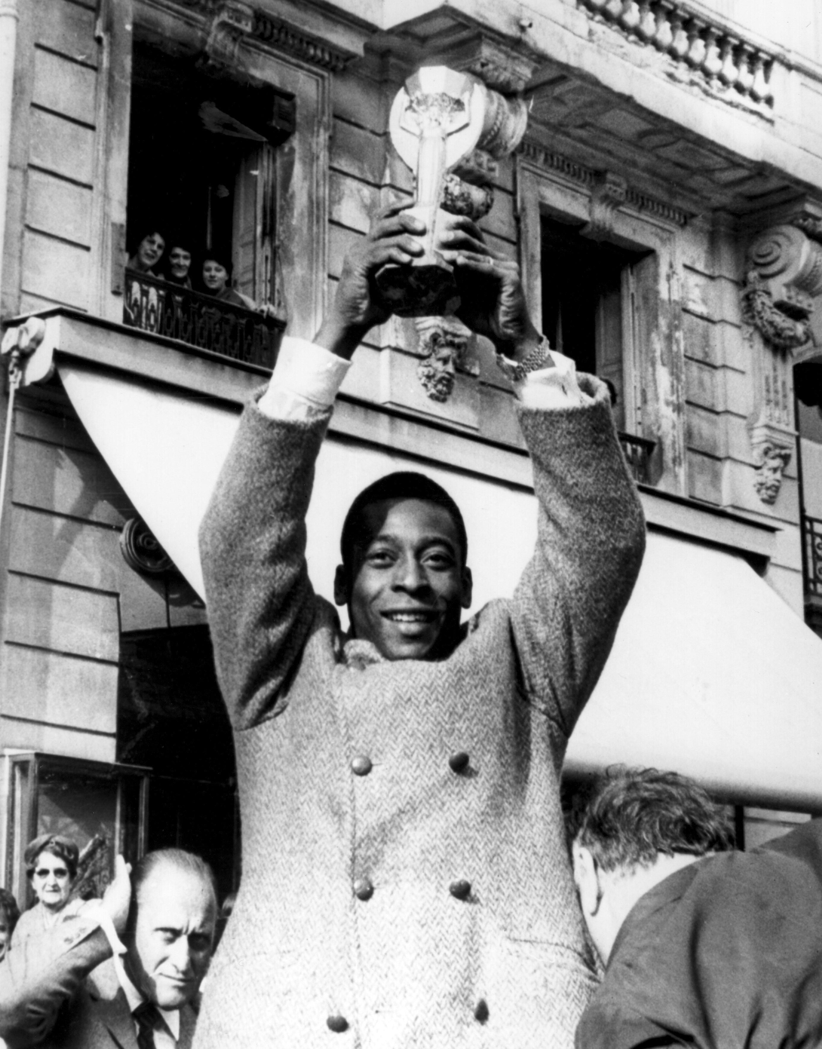Pelé showing off the Jules Rimet Trophy on the Champes Elysees in Paris in March 1971. Brazil got to keep the trophy upon their third win of the World Cup. INPHO/ALLSPORT