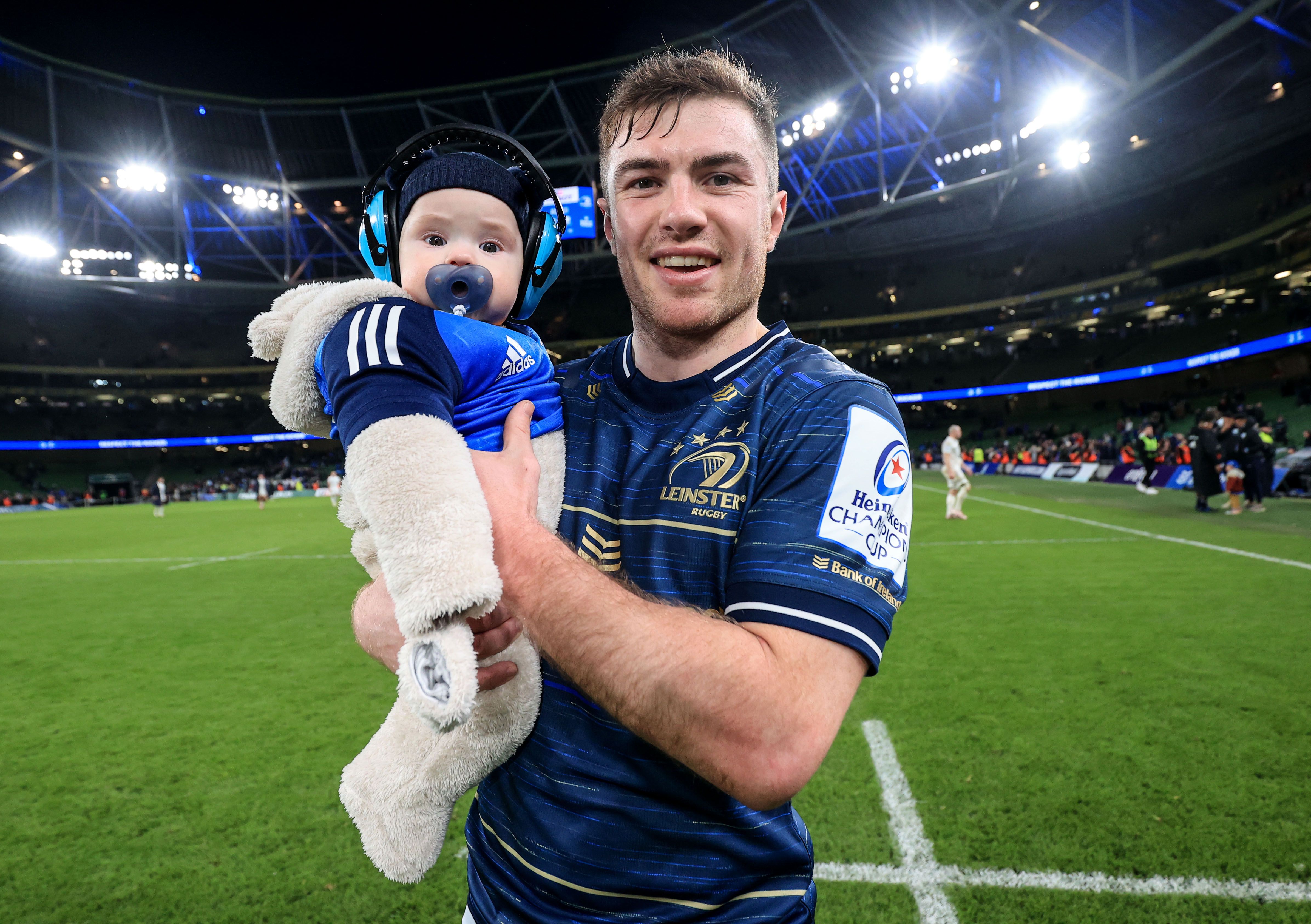 Luke McGrath, pictured with his son Bobby, marked his 50th game with Leinster in the win over French visitors Racing 92. INPHO/DAN SHERIDAN