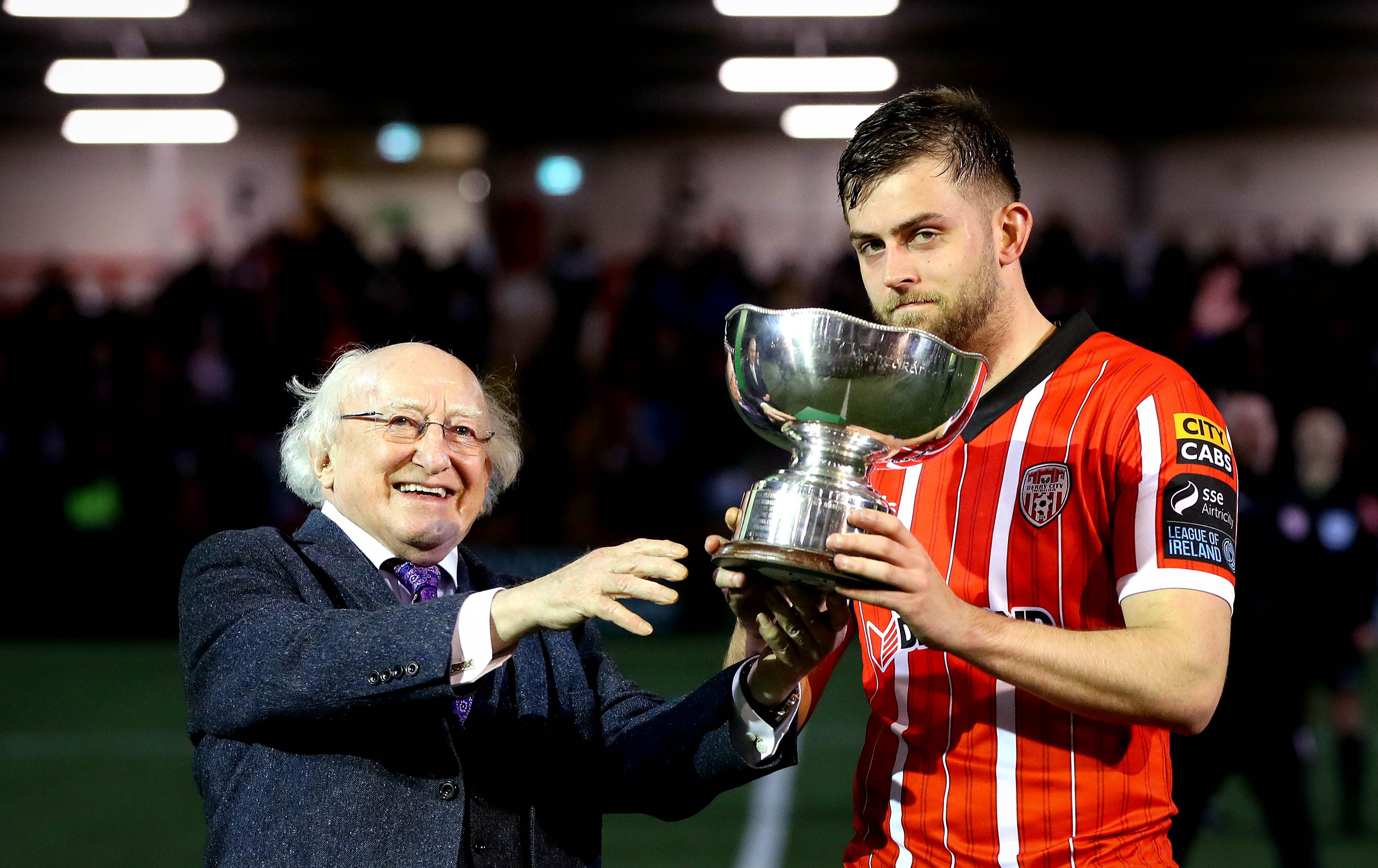 President Michael D. Higgins presents Derry City’s Will Patching with the President’s Cup. INPHO/RYAN BYRNE