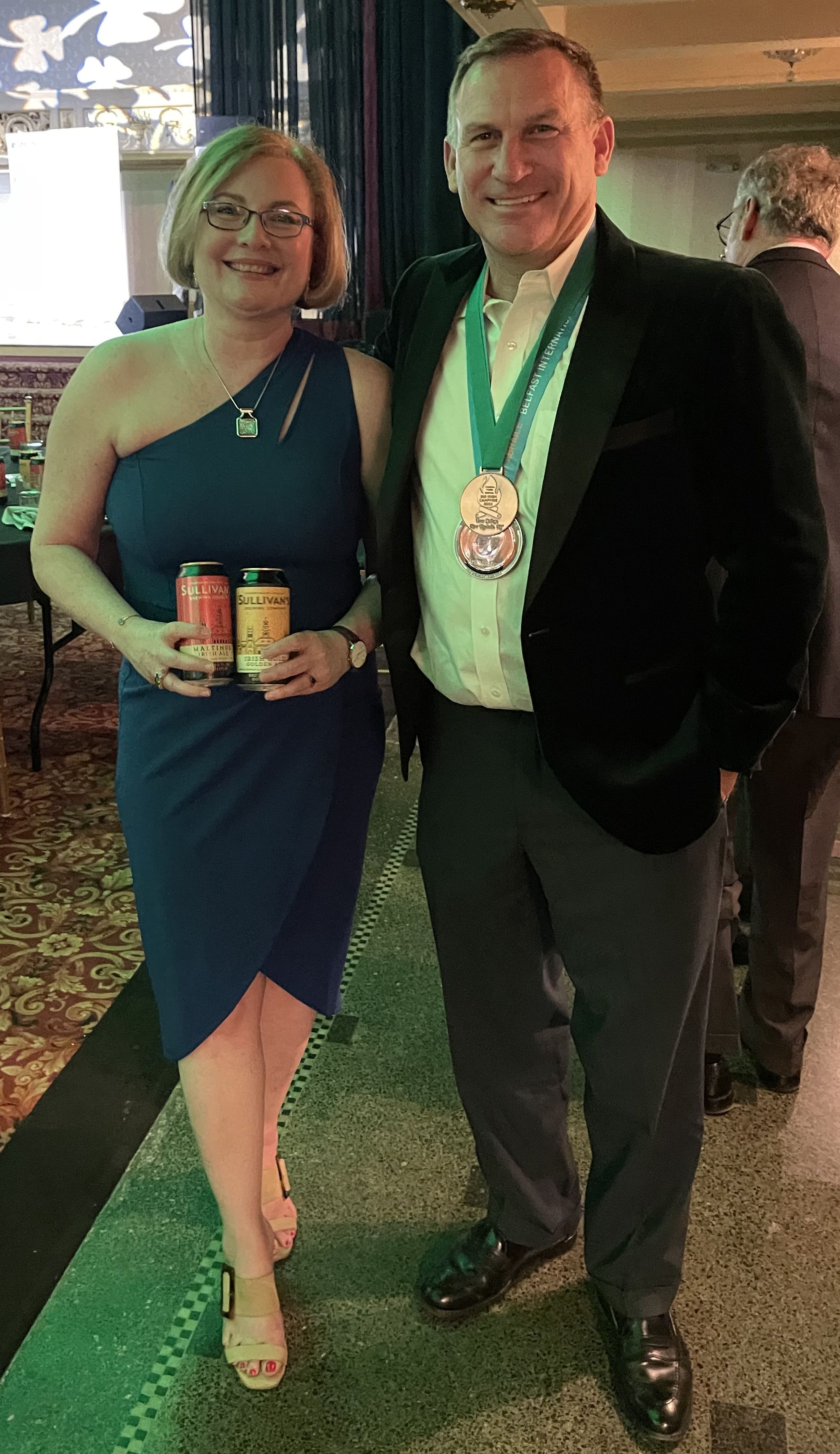 FAD SAOIL & SLÁINTE: Hon Consul of Ireland Helena Nolan & Michael Meade showing off Sullivan's products at the Irish Arts Awards in Buffalo