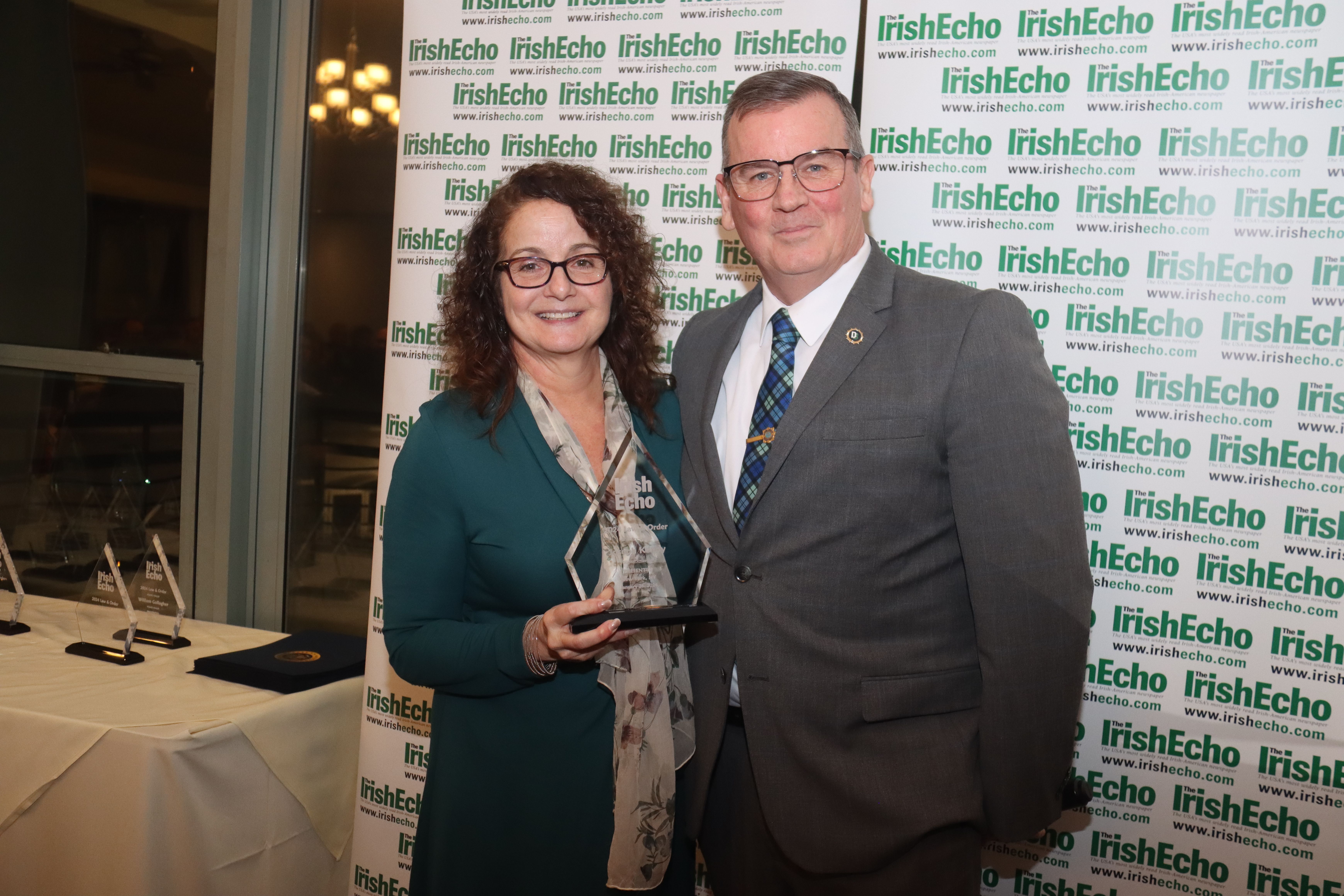 WATCHING THE DETECTIVES: Mary Capella presents an Irish Law & Order award to Joseph Kenny, Chief of Detectives, NYPD