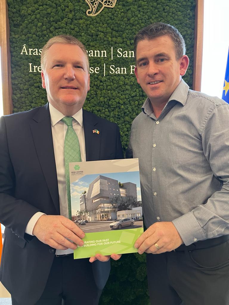 PLEDGE: Liam Reidy presents Minister McGrath with a prospectus for the new center