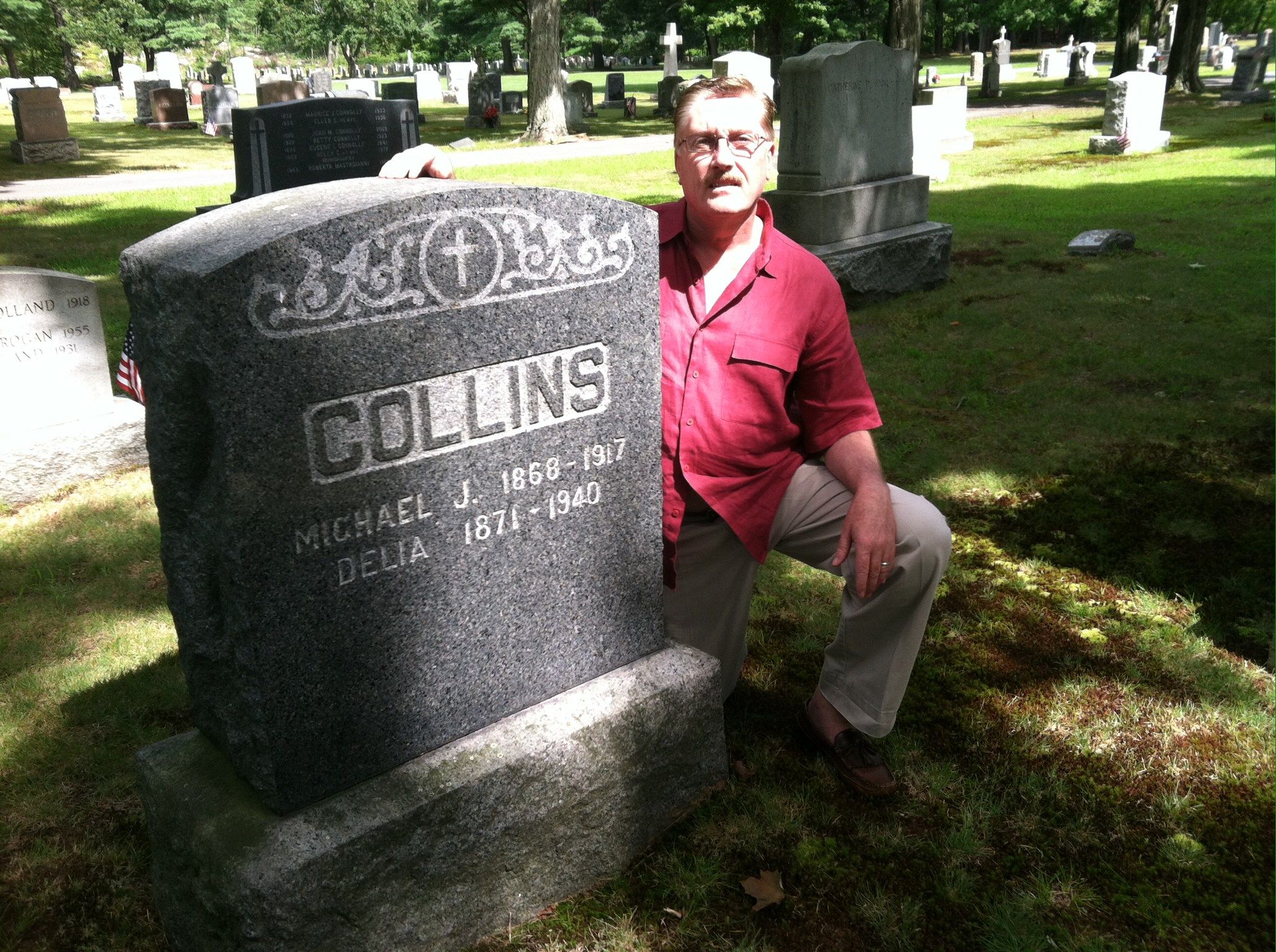 "FIRST GLIMPSE OF BOSTON":The author at the gravesite of his great-grandfather Michael James Collins in St. Mary’s Cemetery, Milford, MA – a landmark in the book.