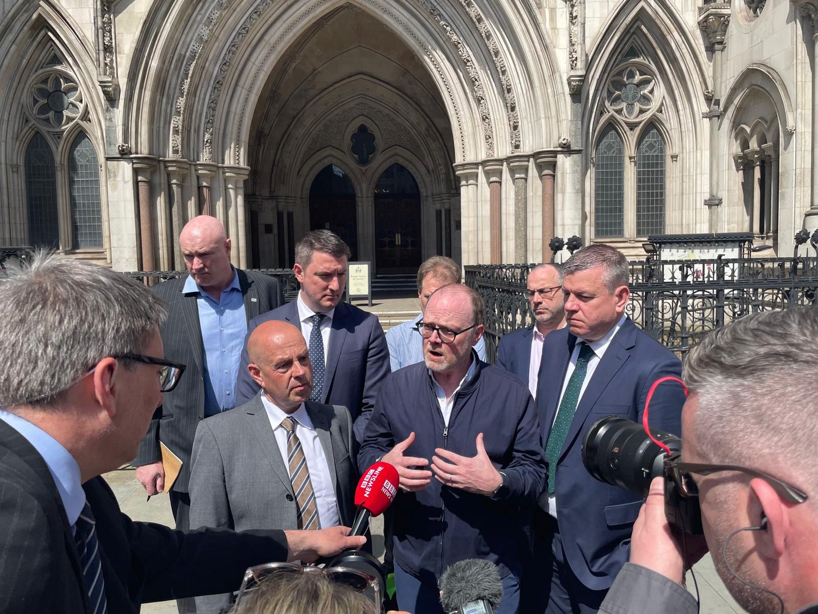 Outside the Royal Courts of justice in London, Trevor Birney, flanked by Niall Murphy and Barry McCaffrey speaks to reporters.
