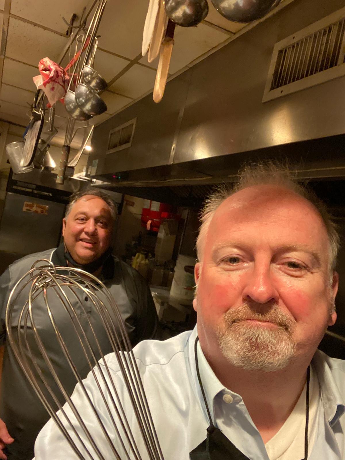 CONFIDENTIAL, NOT SO MUCH: Mark Pascal and Francis Schott in the kitchen of Catherine Lombardi
