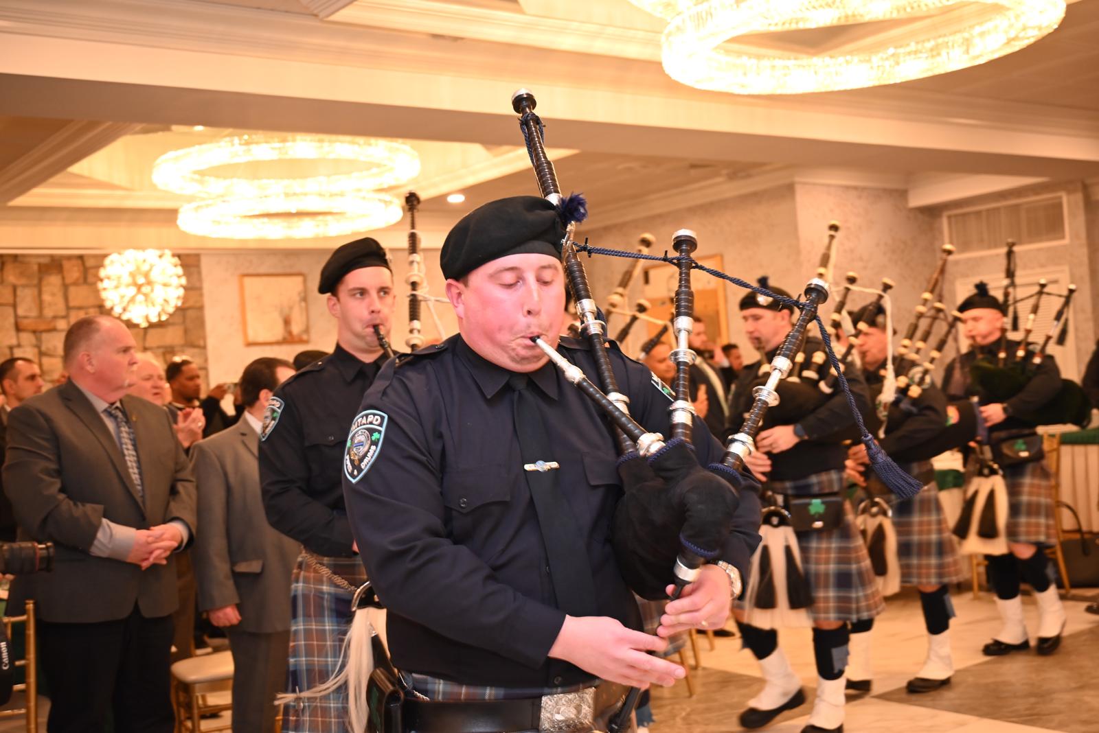 PIPED IN: MTAPD Pipe and Drums leads in Emerald Grand Council President Martin Bellew and guest of honor