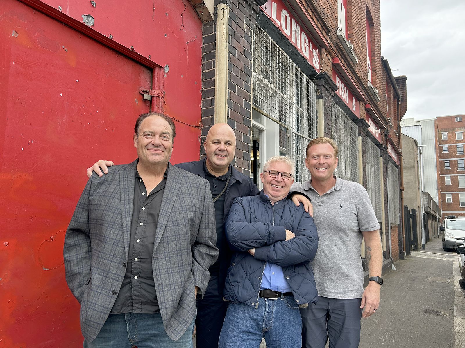 CHIPPER: After a fish supper at Long's famous chipper in Belfast are Mike Flannery, host Ciarán Sheehan, Gary Gilchirst of Oracle in San Francisco and Lieutenant Tommy Ryan of the NY-NJ Port Authority P.D. 