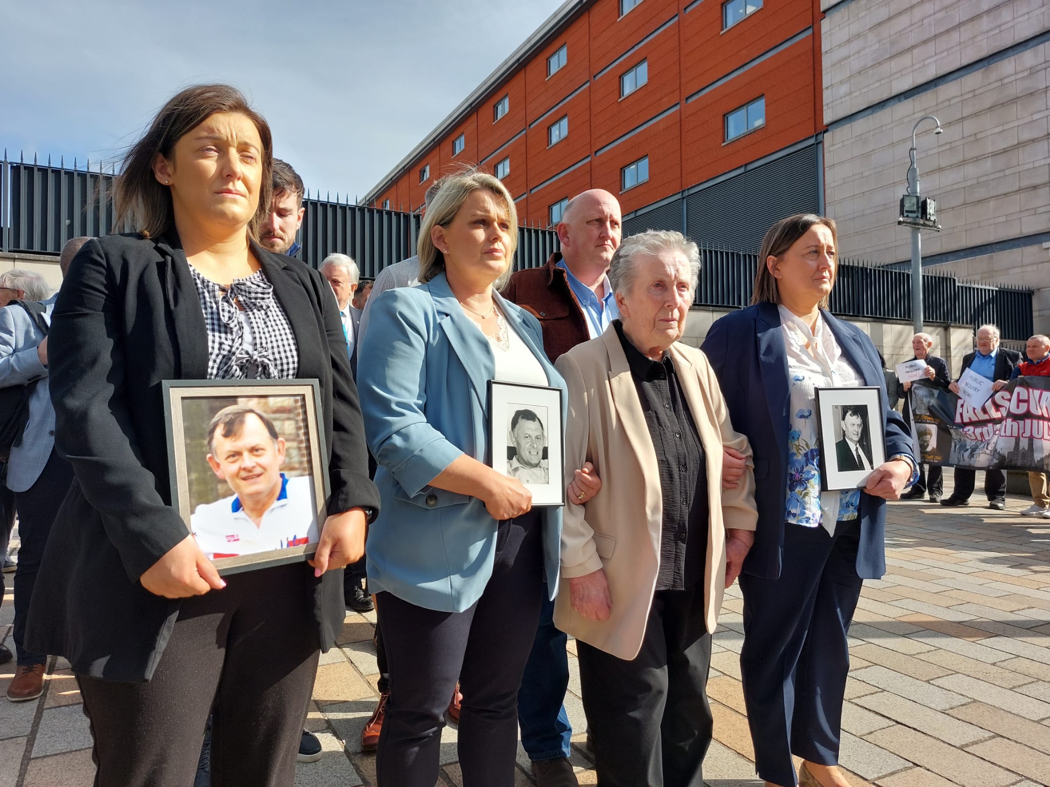 DETERMINED: Bridie Brown (87) and family arrive at the Court of Appeal in Belfast with portraits of their murdered husband and father