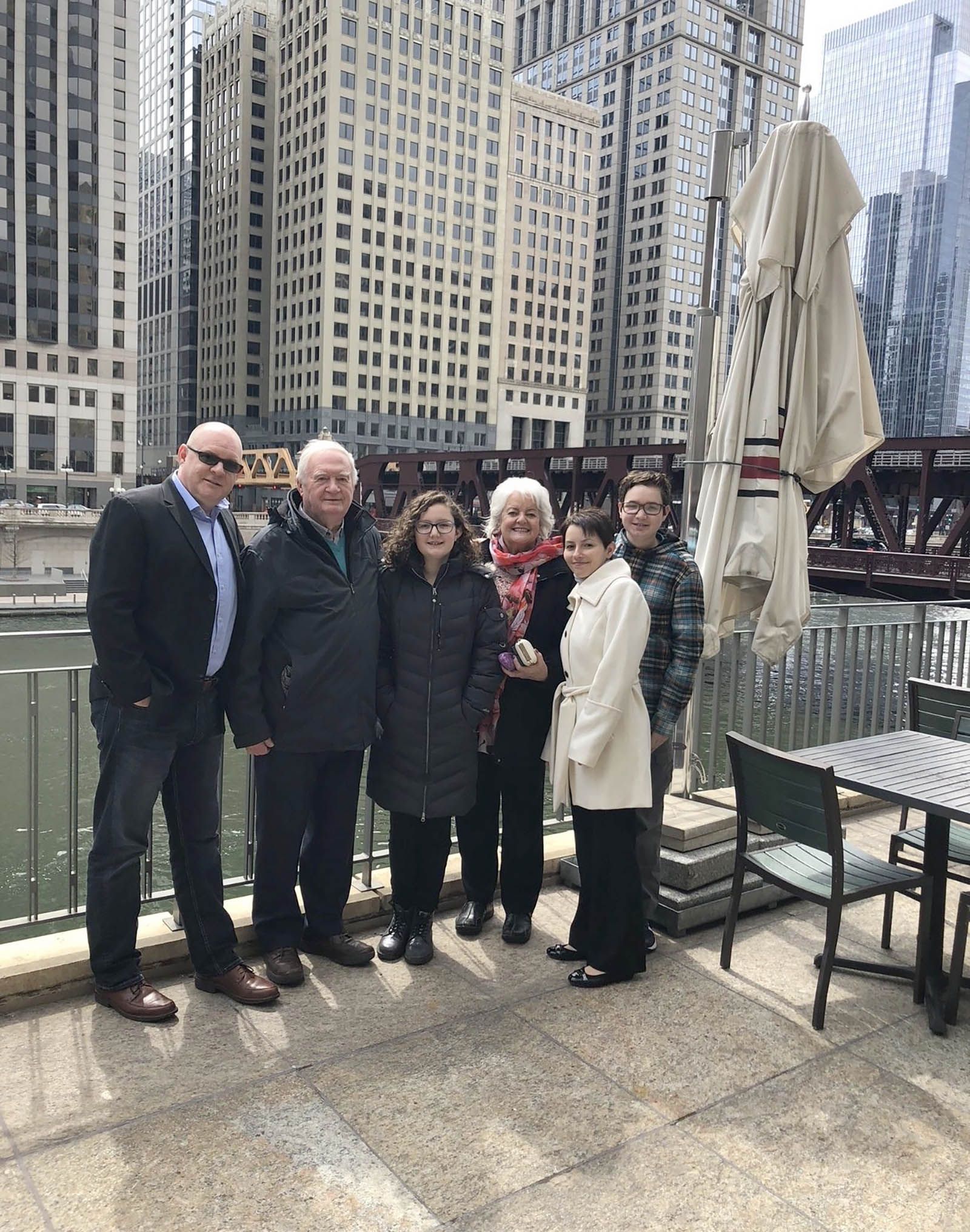 Joe on left with mom, dad, and family members in Chicago