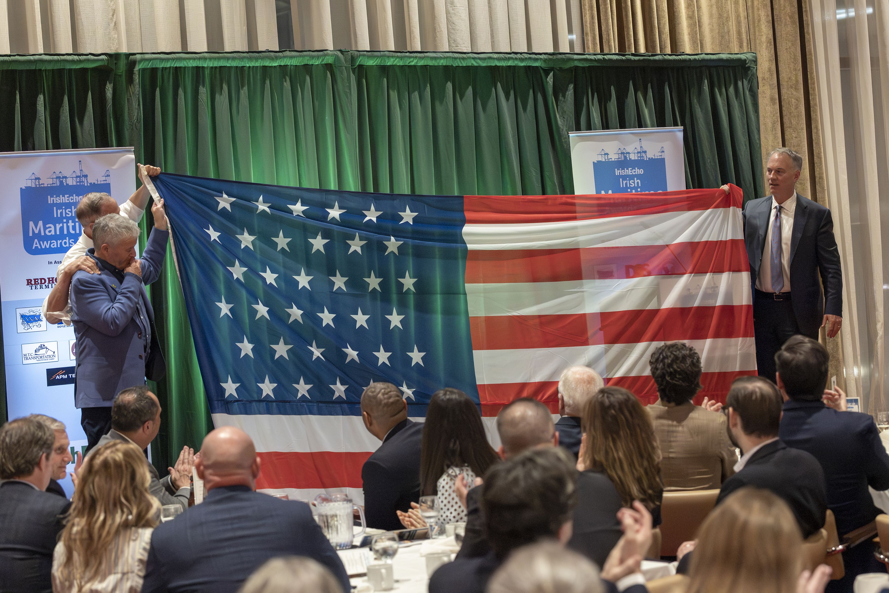 FENIAN ESCAPE: A replica of the Stars & Stripes flown from the Catalpa was unfurled by Mayor Jon Mitchell of New Bedford, MA, Gov. Martin O'Malley and famed Irish sailor Enda O'Coineen. Pic: Fred Nye