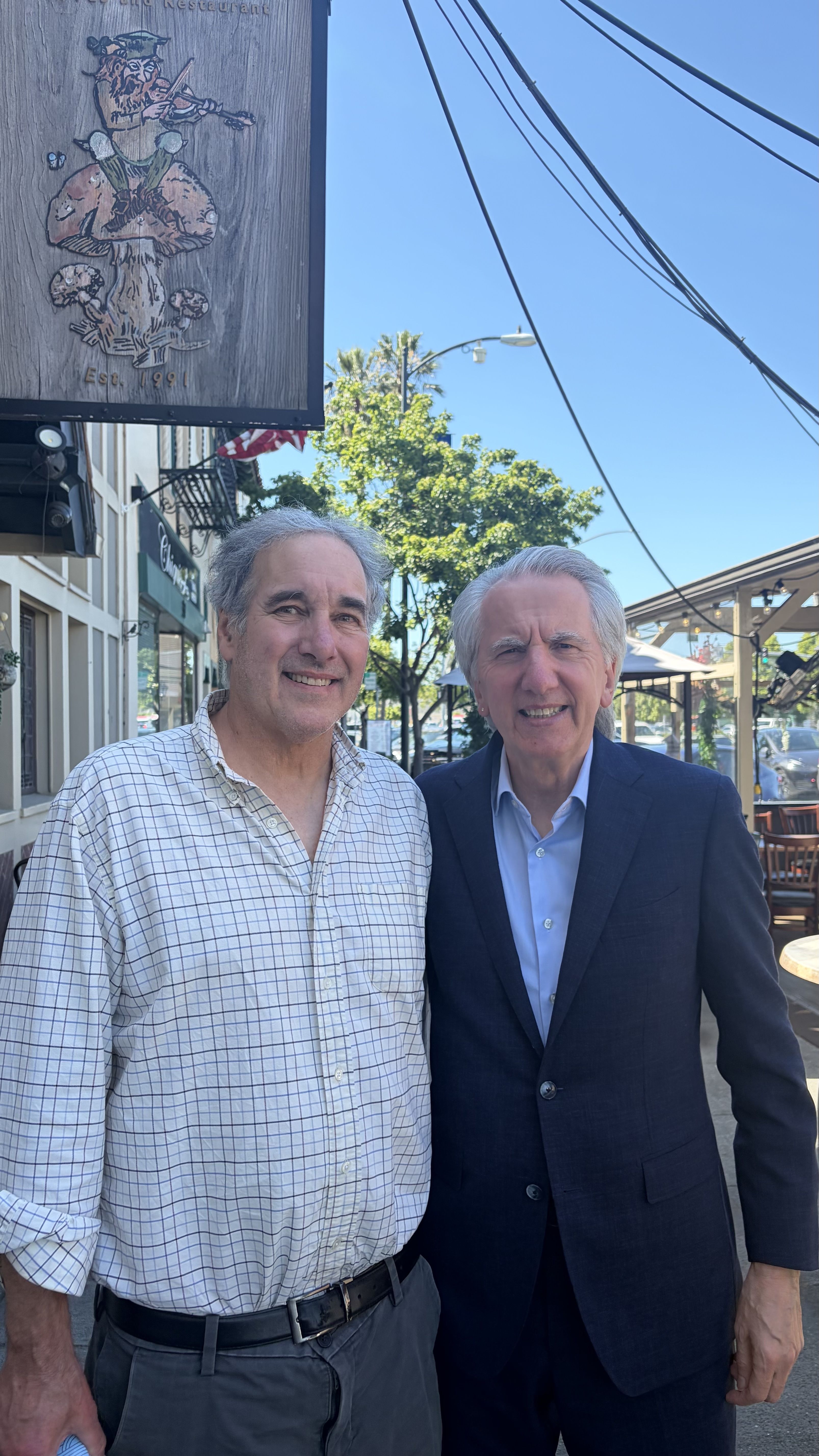 GREEN TEAM: Outside Fiddler's Green tavern in Millbrea this week, Mike Casey (right) with teh author