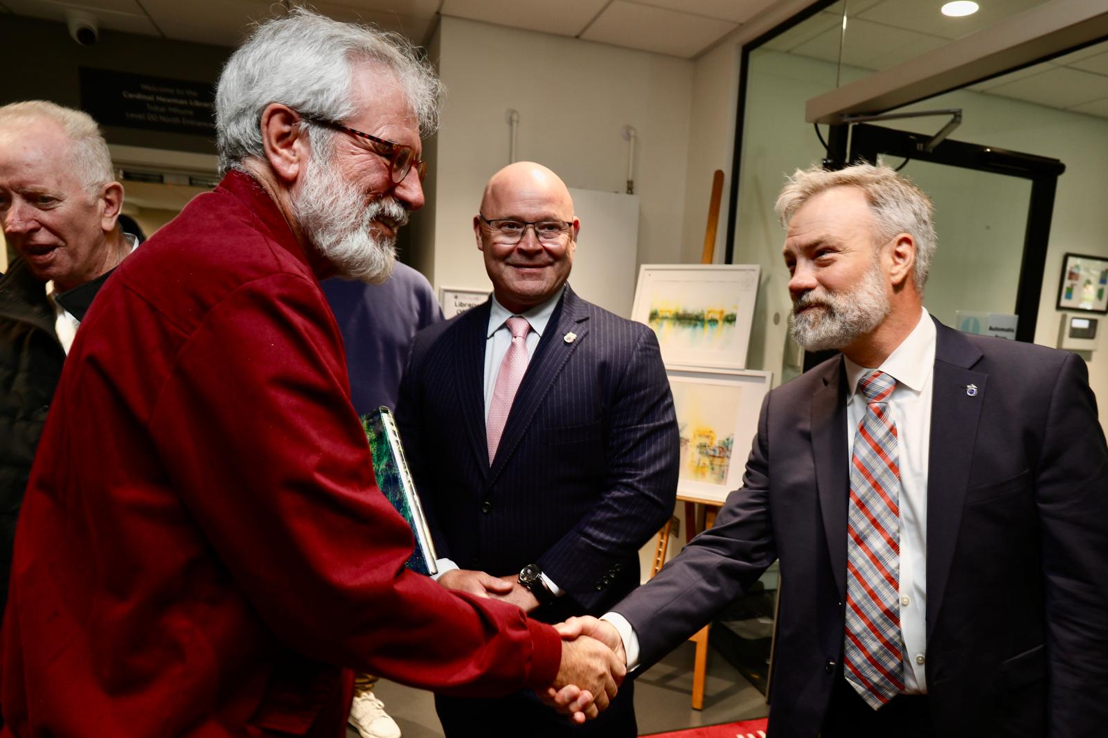 FÁILTE: Gerry Adams welcomes Teamsters chief of staff Brain Rainville to Belfast