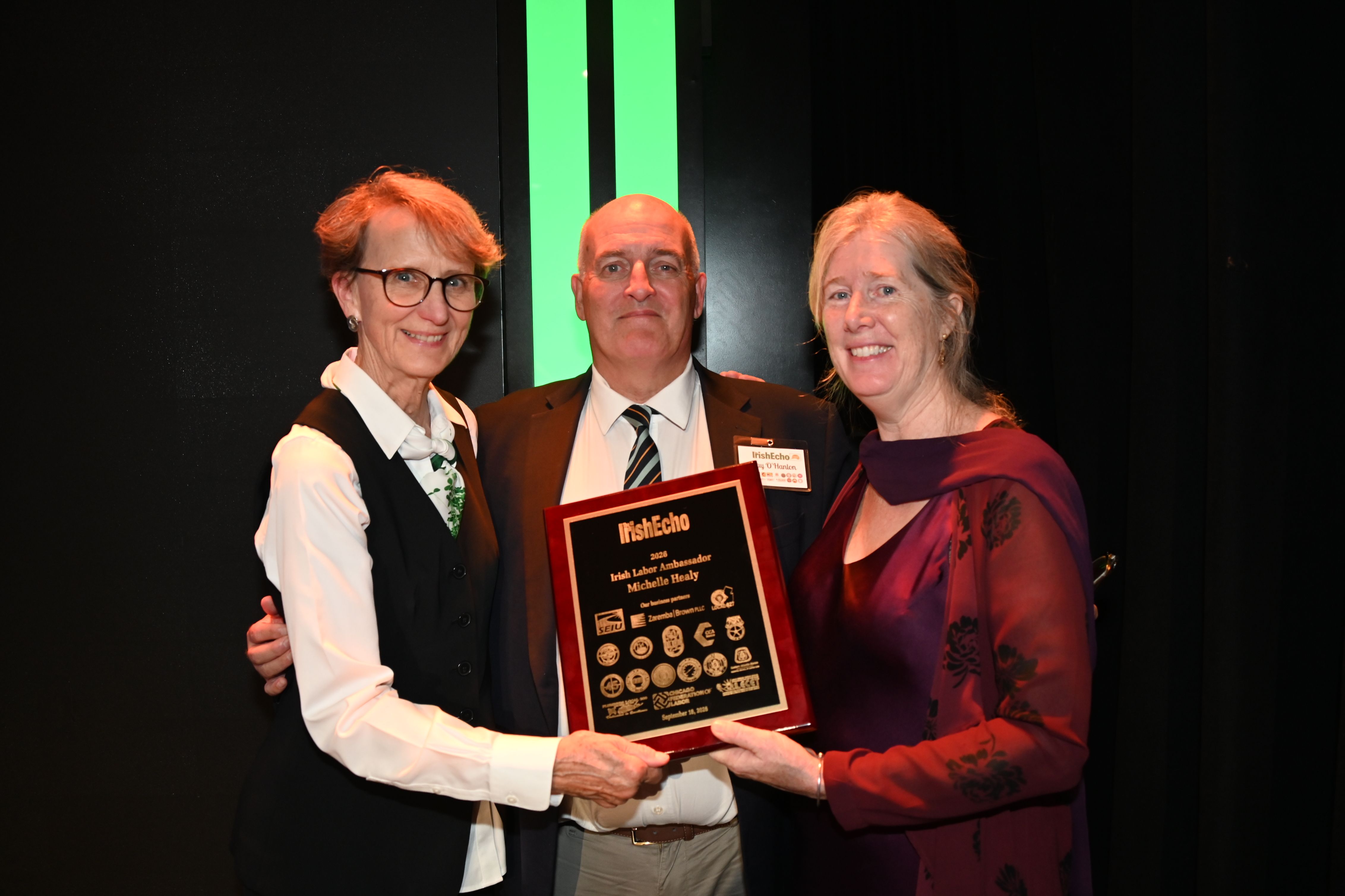 SALUTE: Ray O'Hanlon, Editor of Irish Echo, with Mary Kay Henry, former President of the Service Employees International Union (left) who presented the Ambassador Award to Michelle Healy of Boston